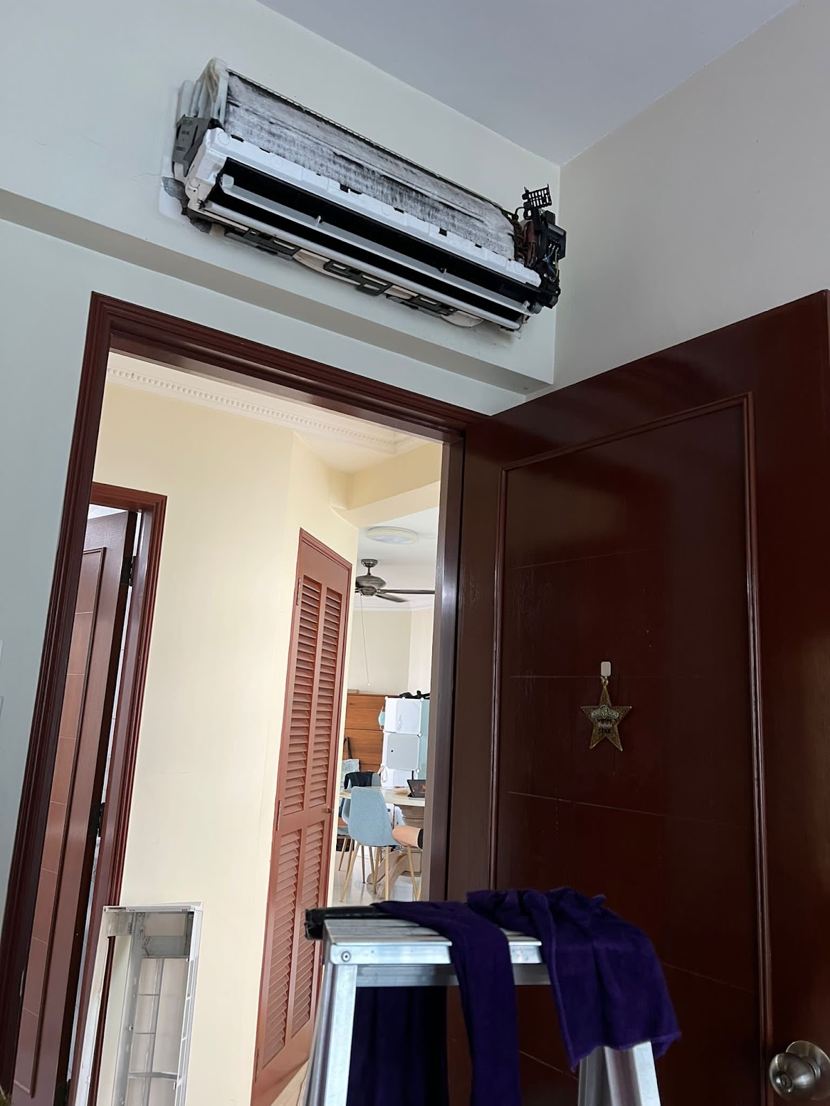 Opened indoor unit showing the coil before cleaning